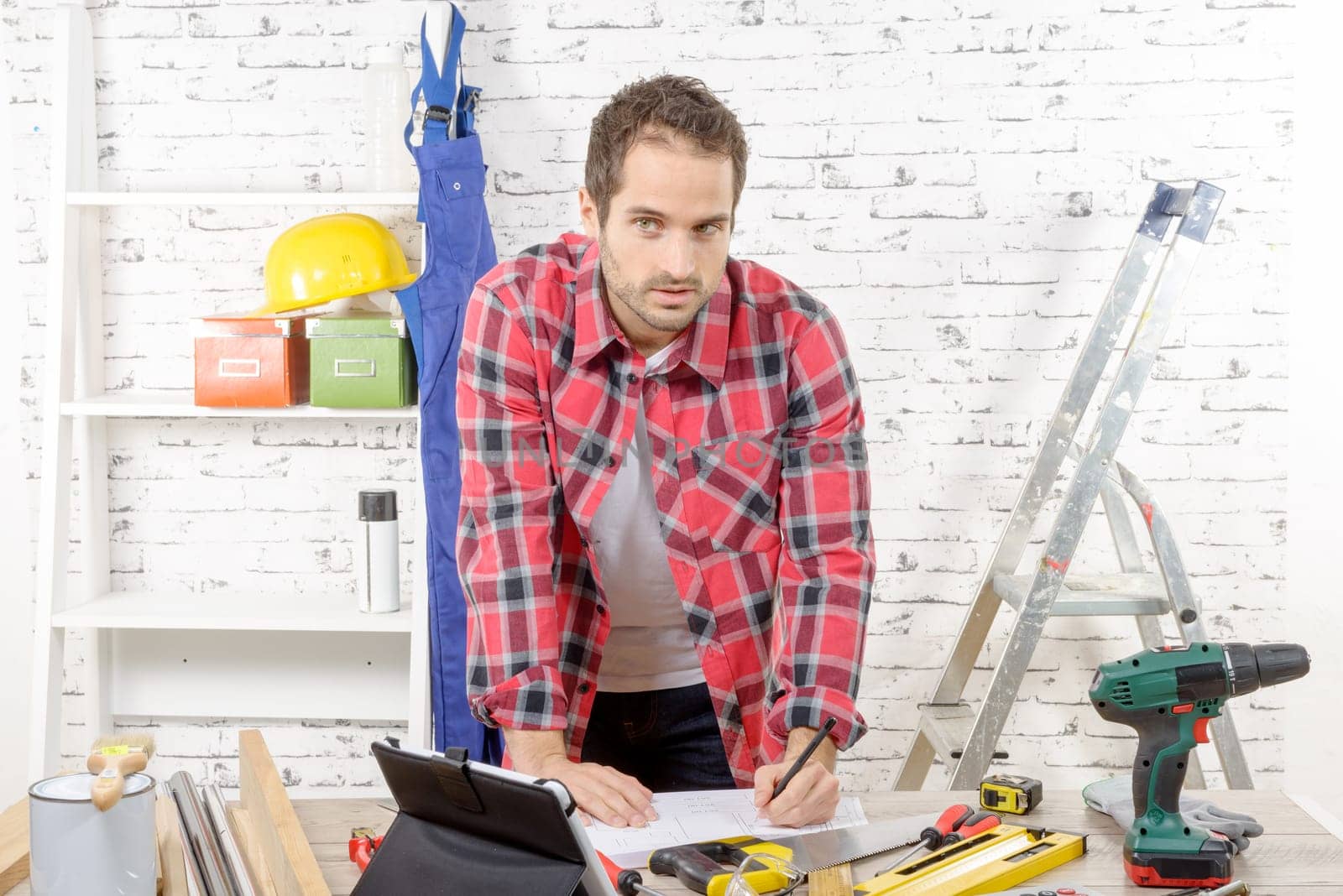 a young carpenter in his workshop