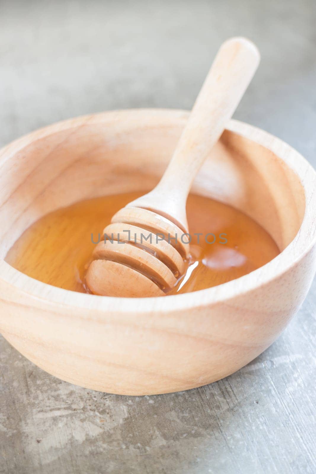 Golden honey cup and dipper, stock photo