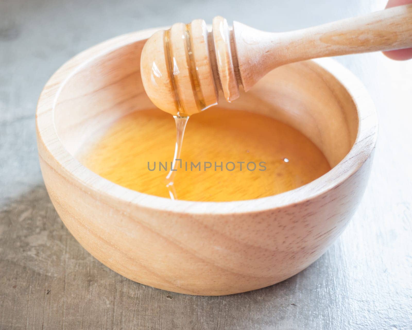 Golden honey cup and dipper, stock photo