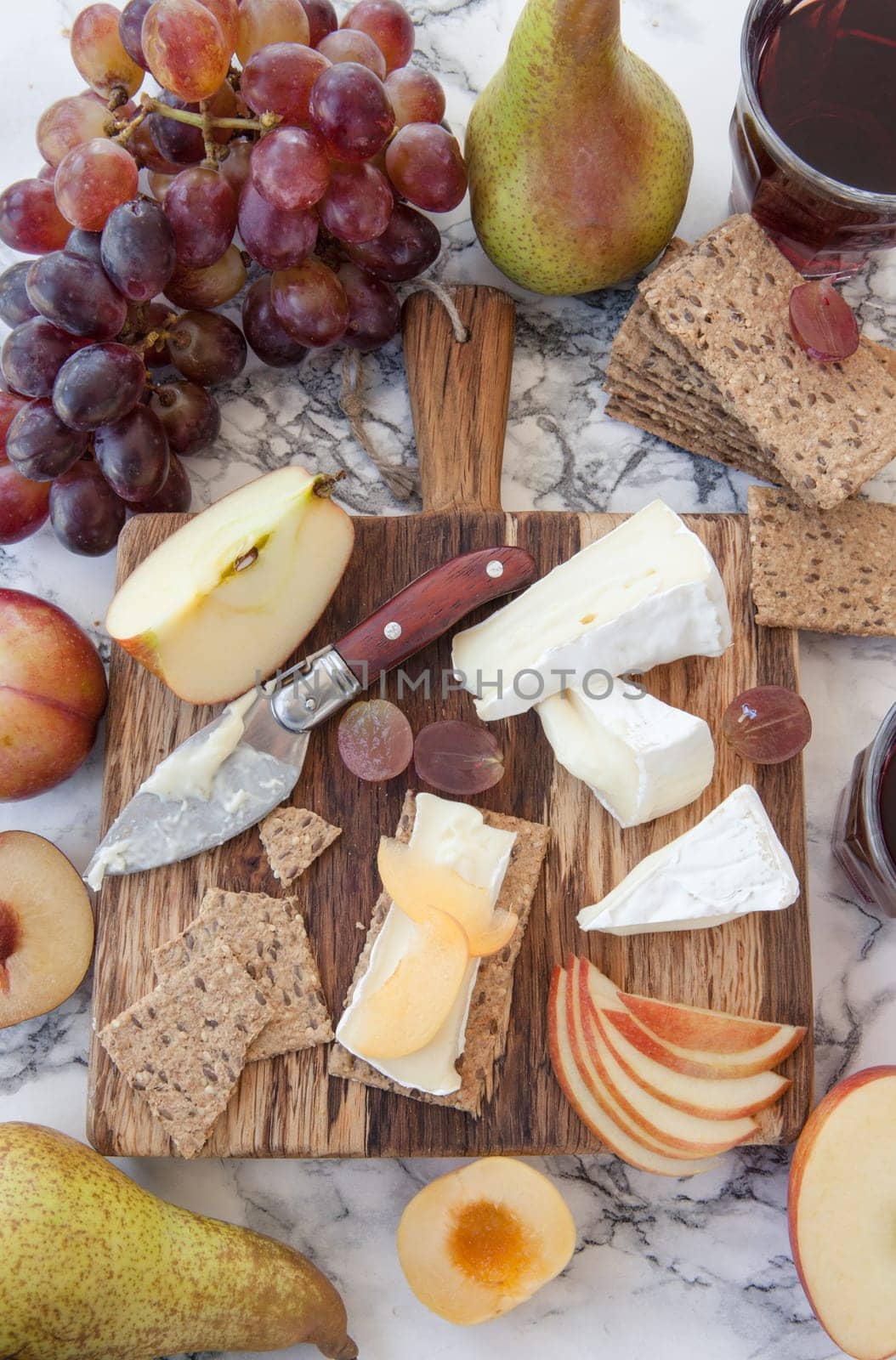 Rustic kaese platte with fruits and crisps