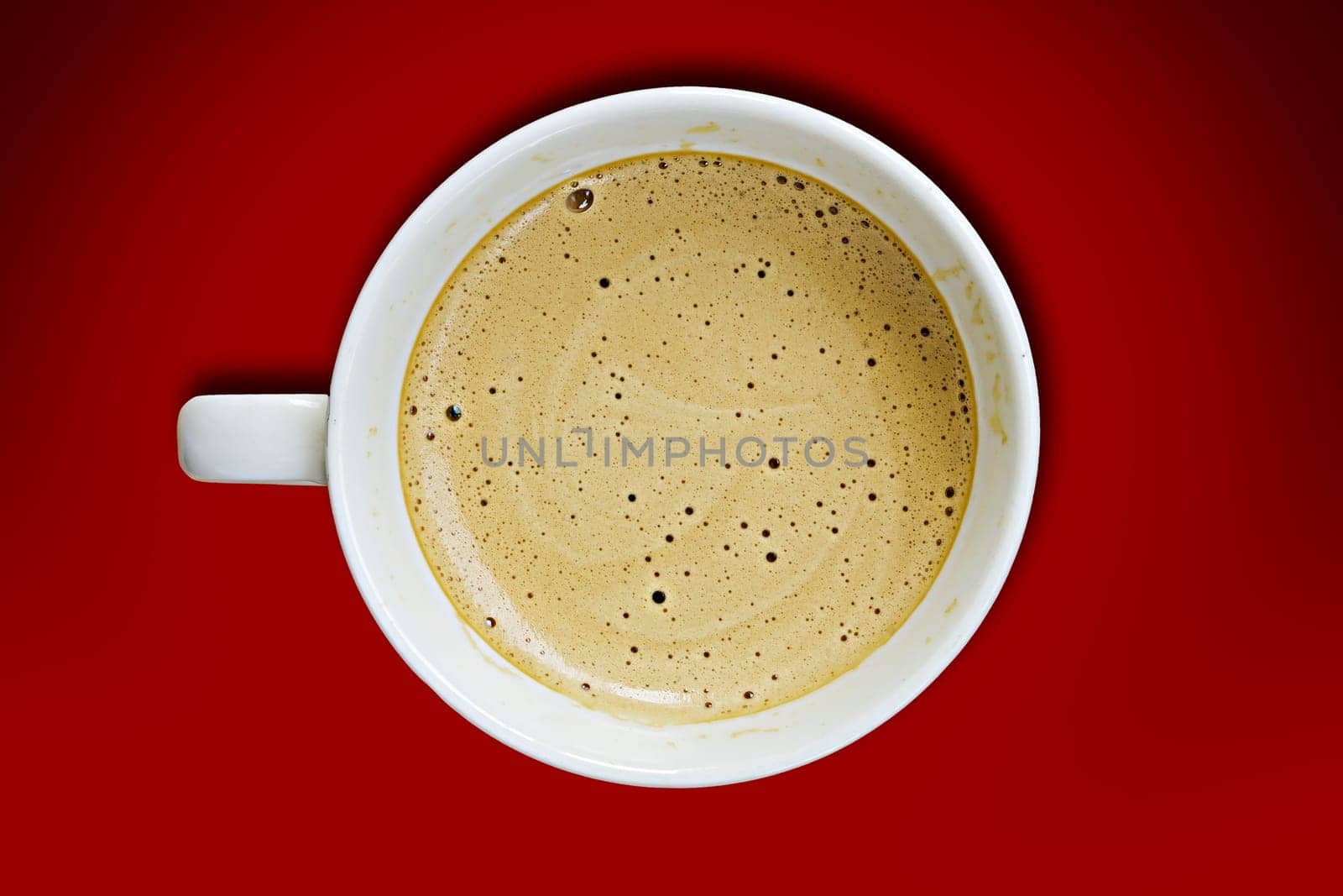Coffee cup on a red background.