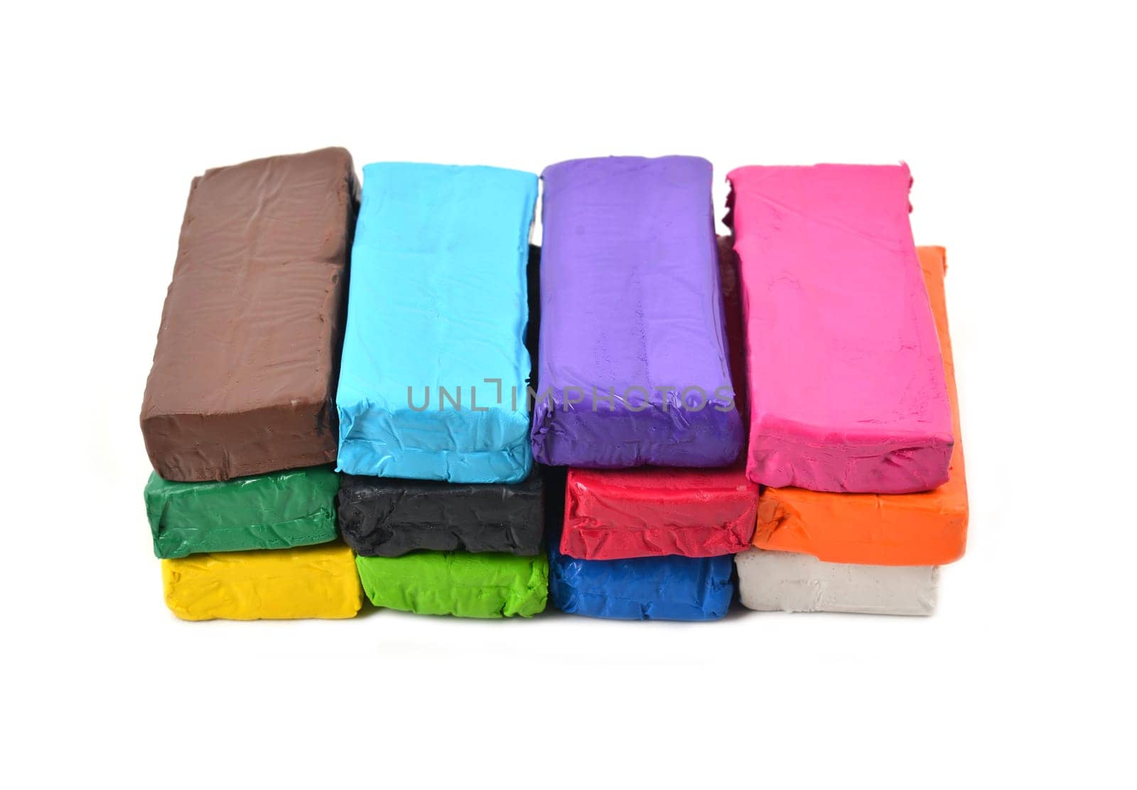 colorful modeling clay or plasticine for children on white background