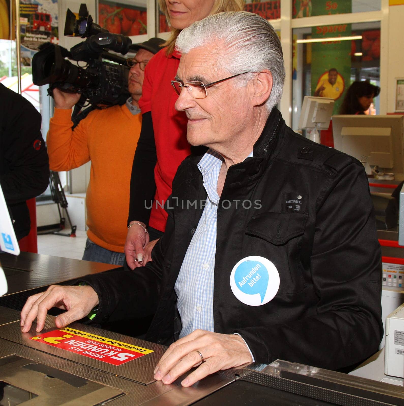 Sky du Mont at the request round-up action at REWE for disadvantaged children