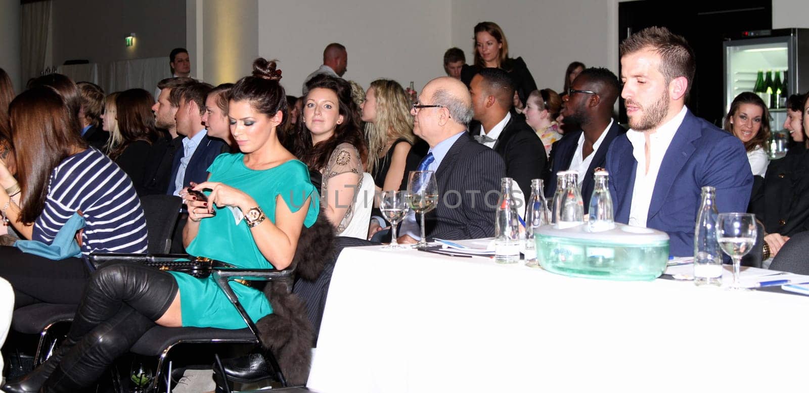 Rafael van der Vaart and Sabia Boulahrouz flirting at an event