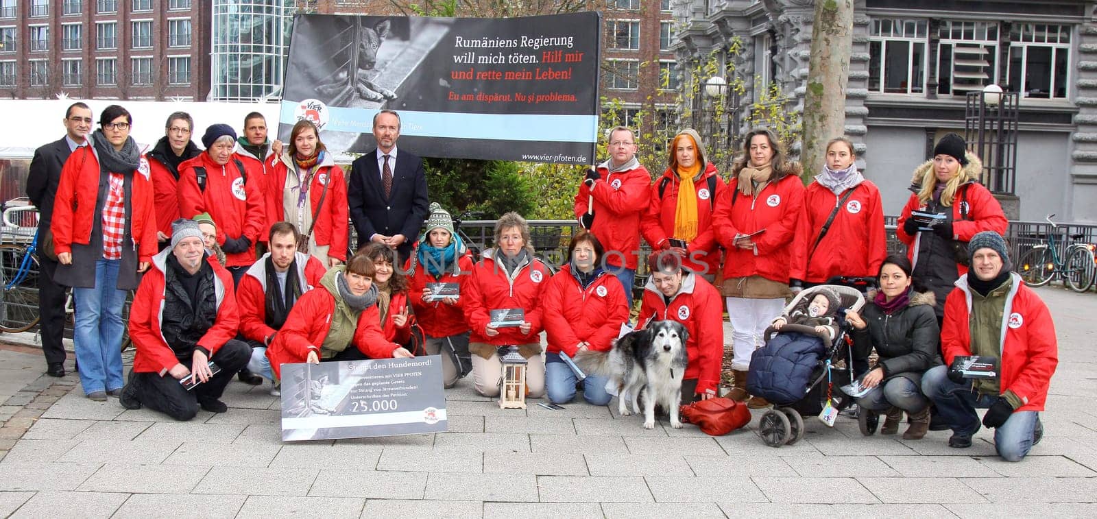 Klaus Rainer Kirchhof (Honorarconsul Rumaenien) and Dr.Martina Stephany (Four Paws) with activists protest action in front of the Romanian Consulate in Hamburg together with FOUR PFOTEN against the Moerder law PL 912,which was passed by the Romanian Parliament on 22.11.2011,which legalizes the unscrupulous toning of street dogs. FOUR PFOTEN will hand over this protest to Romanian President Traian Basescu,as only he can overturn the law now.  Romania has enacted a law allowing the mass death of stray dogs. Studies have shown that only a nationwide castration of the stray dogs reduces the dog population.