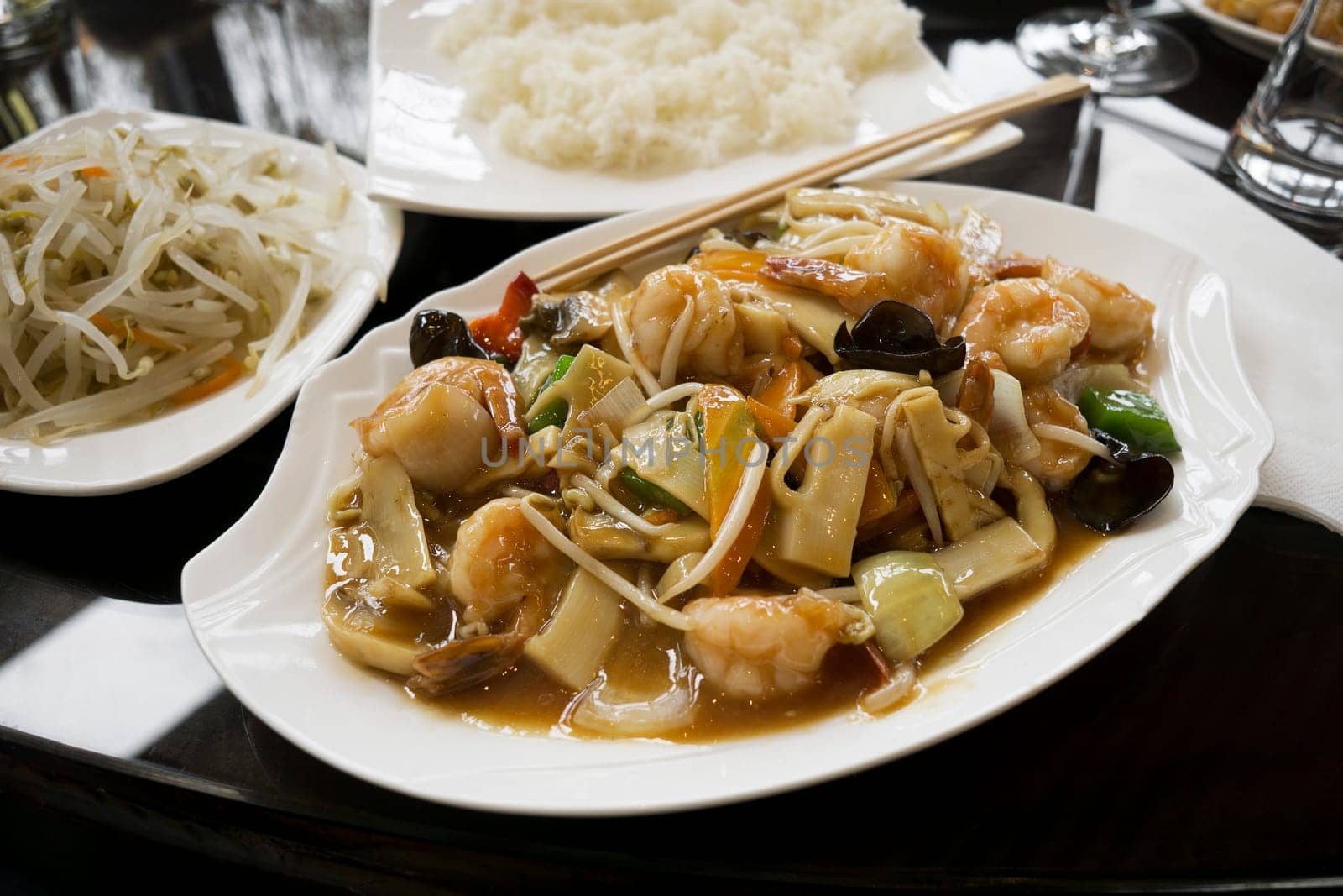 Chinese food - stir fry shrimps with vegetables and mushrooms.