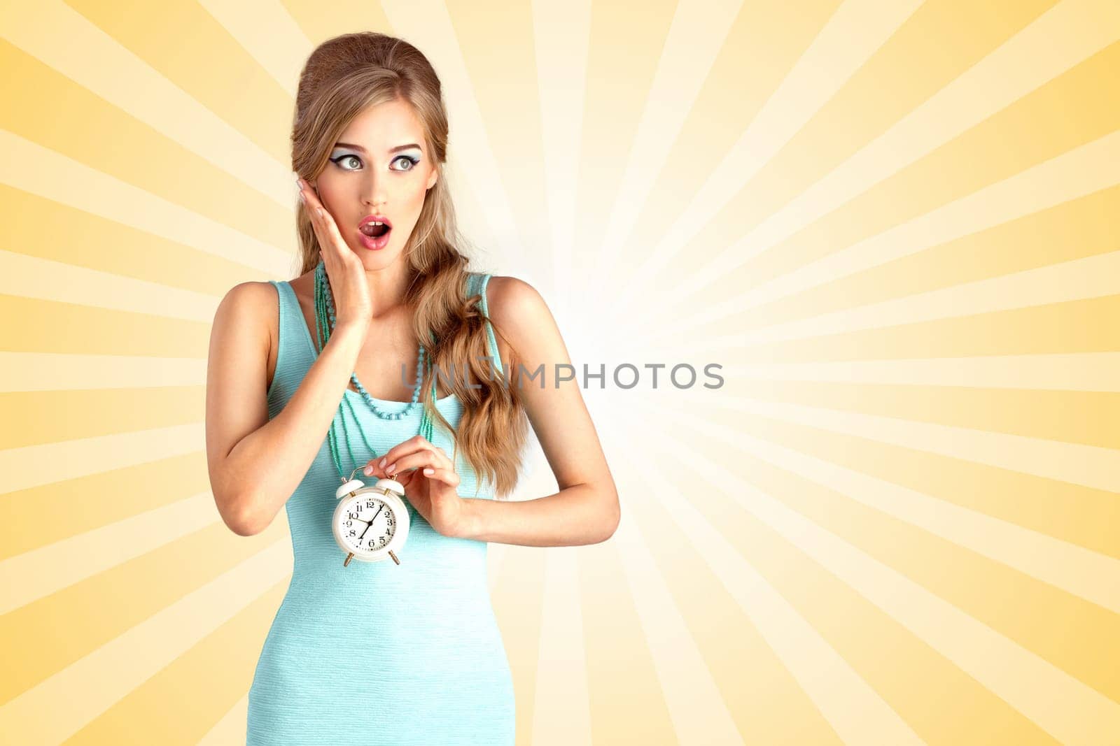 Creative photo of a shocked pin-up girl being late and holding a retro alarm clock on colorful abstract cartoon style background.