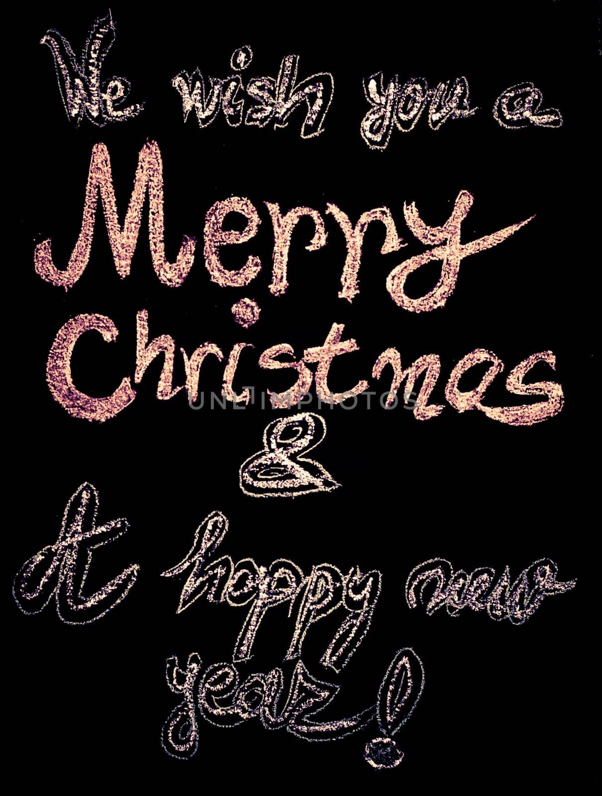 We wish you a Merry Christmas and a happy new year, hand writing with chalk on blackboard, vintage concept