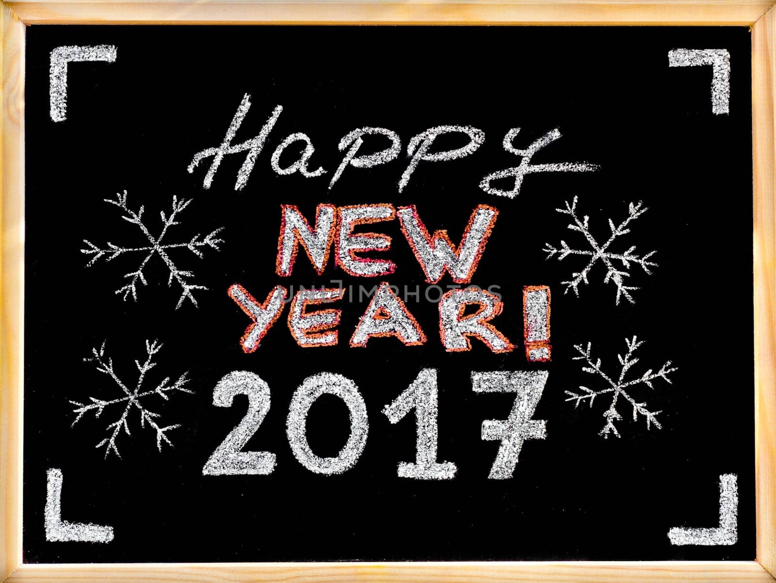 Happy new year 2017, hand writing with chalk on blackboard, vintage concept