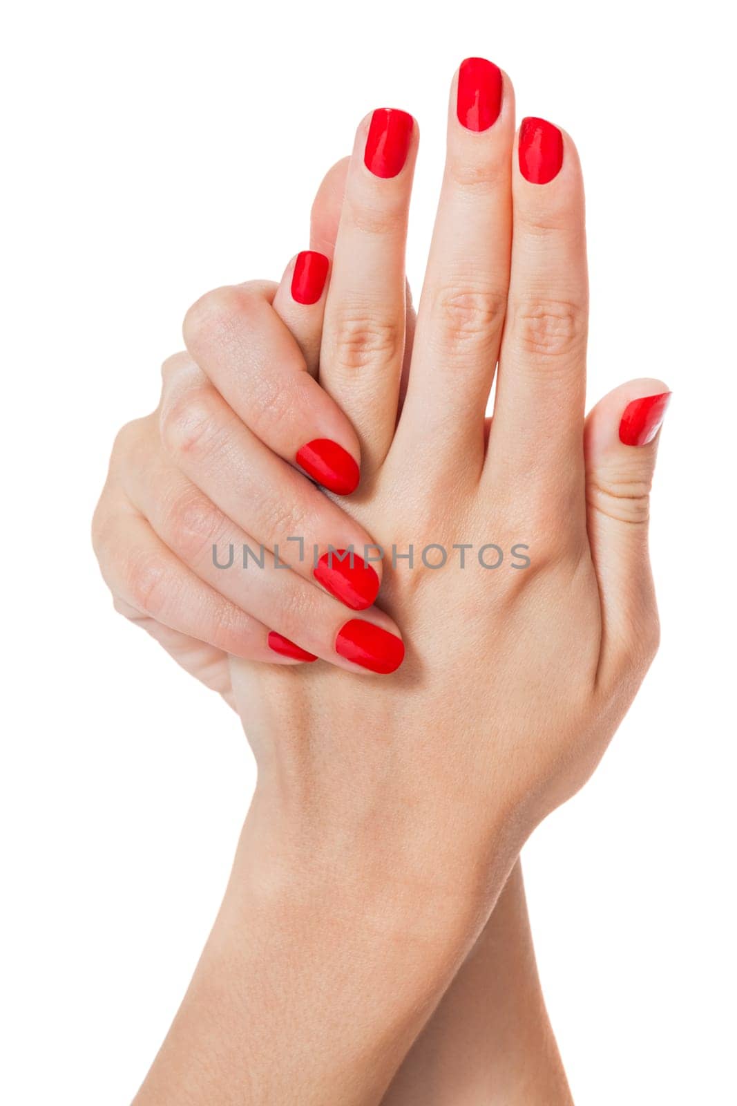 Women's hands with beautiful well-groomed fingers and red nail polish wellness beauty spa close up isolated on white background