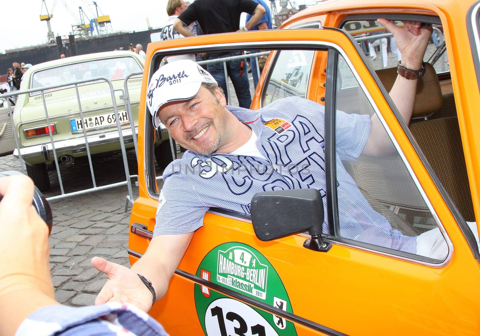 Rally start participants with their oldies of the Hamburg-Berlin-Klassik at the fish wholesale market in Hamburg.