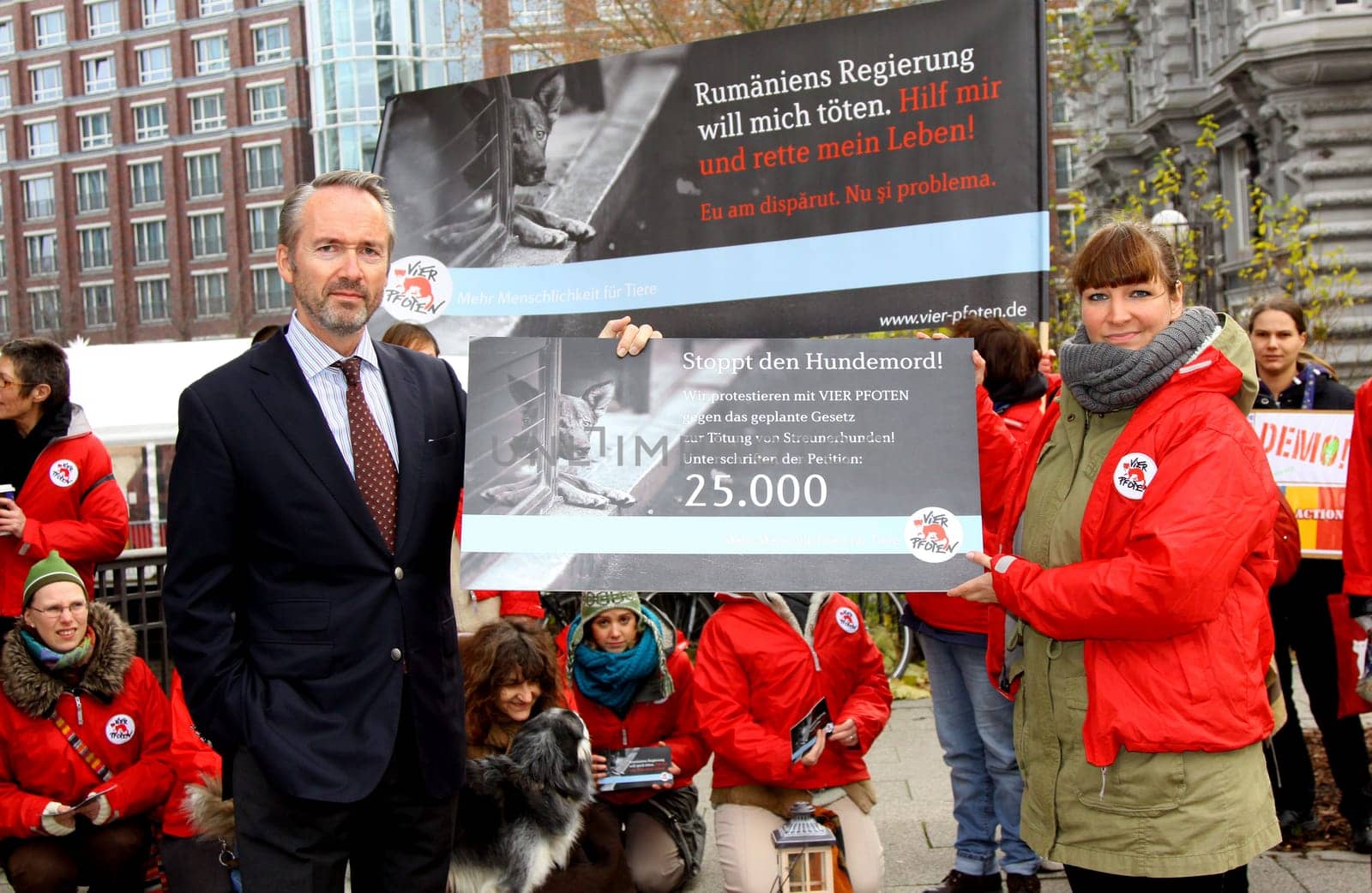 Klaus Rainer Kirchhof (Honorary Consul Romania) and Dr.Martina Stephany (Four Paws) Protest action in front of the Romanian Consulate in Hamburg together with VIER PFOTEN against the Moerderic law PL 912 passed by the Rumaenian Parliament on 22.11.2011,which legalizes the unscrupulous killing of street dogs. FOUR PAWS will hand over this protest to Romanian President Traian Basescu,as only he can now overturn the law.  Romania has passed a law that allows the mass killing of stray dogs. Studies have shown that only a comprehensive castration of stray dogs reduces the dog population.