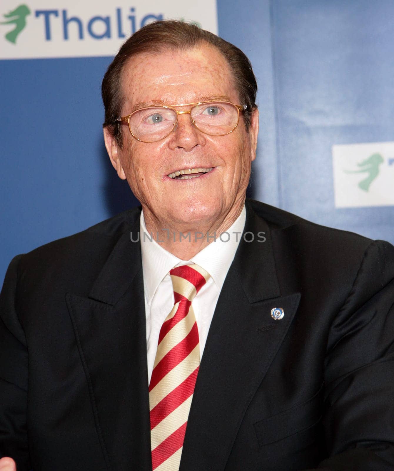 Sir Roger Moore and wife Lady Kristina at Thalia Hamburg where he presented his book My Word Is My Bond