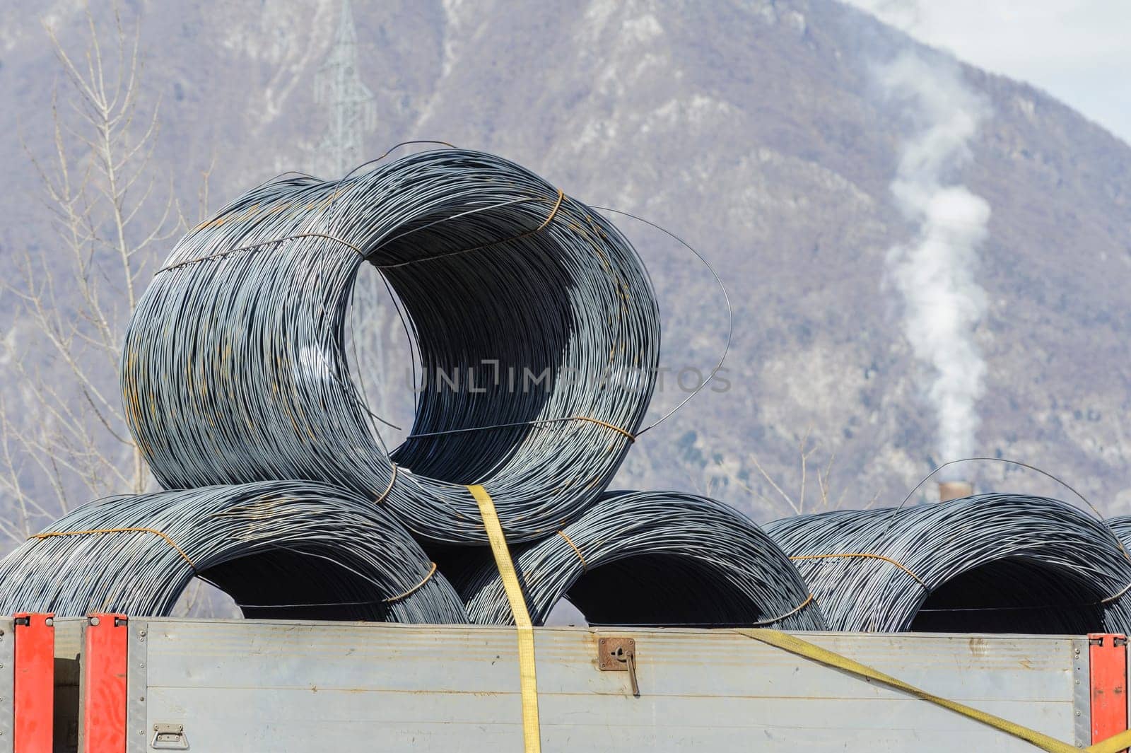 Steel Wire Rolls. Steel wire rolls industrial construction products on transport trailer.
