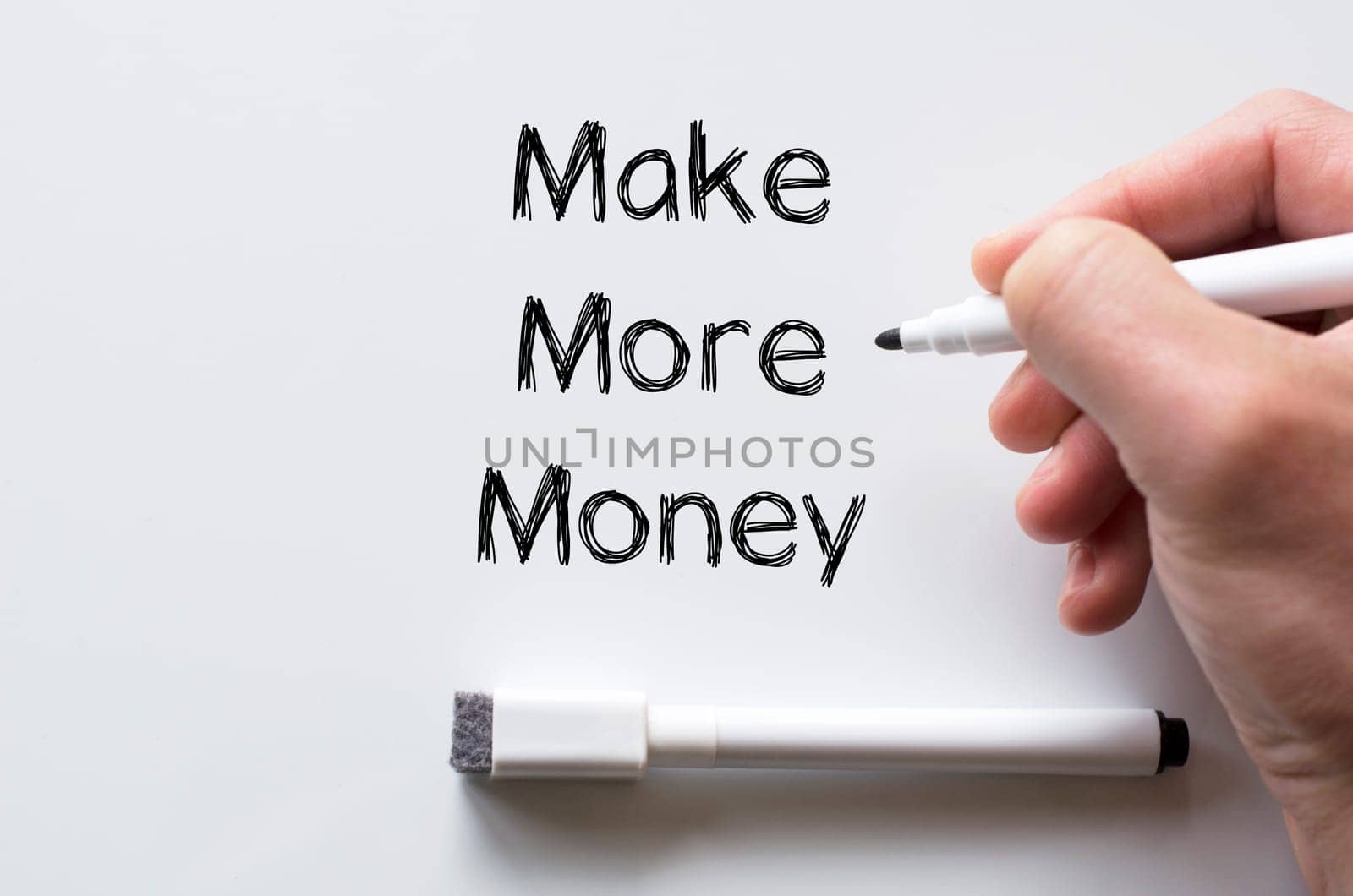 Human hand writing make more money on whiteboard