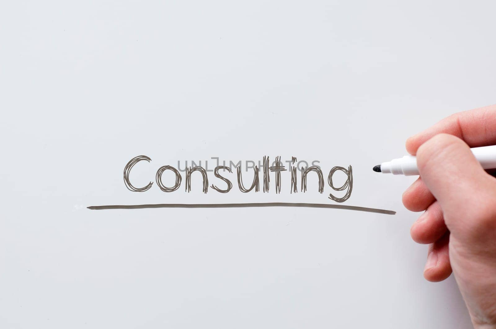 Human hand writing consulting on whiteboard