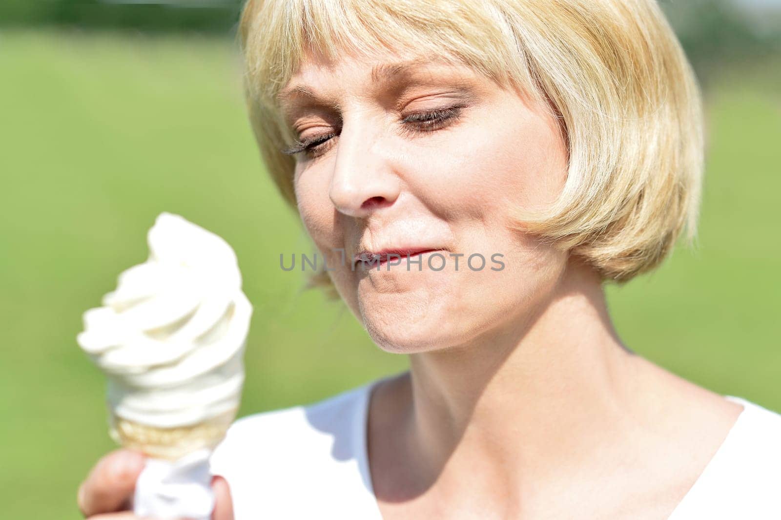 Attractive woman on vacation having fun and eating ice cream