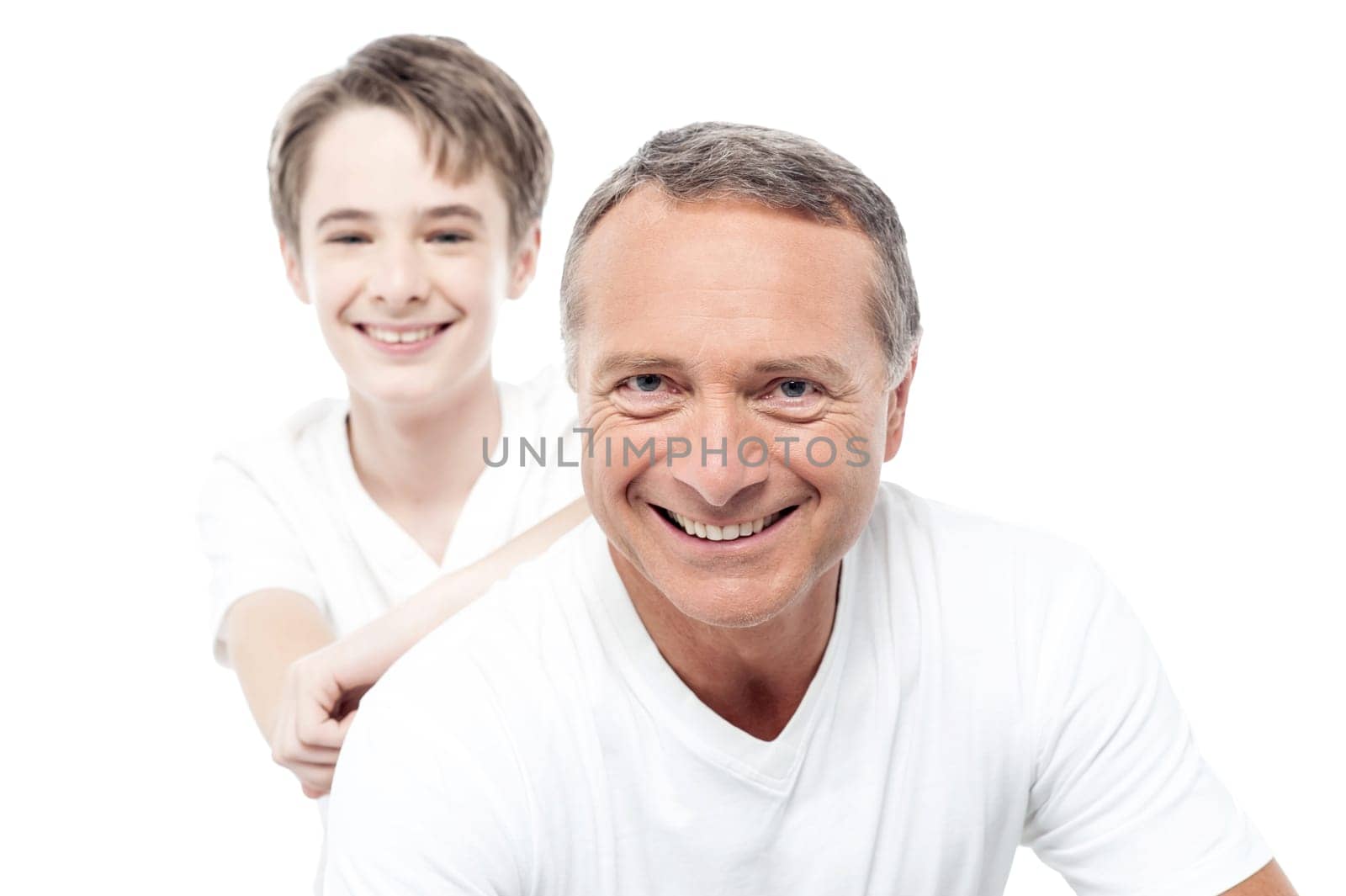 Father and son are smiling and bonding over white.