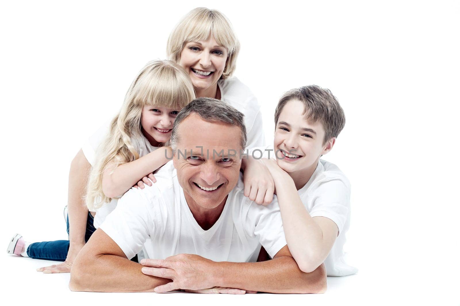 Caucasian happy family lying down on the floor.