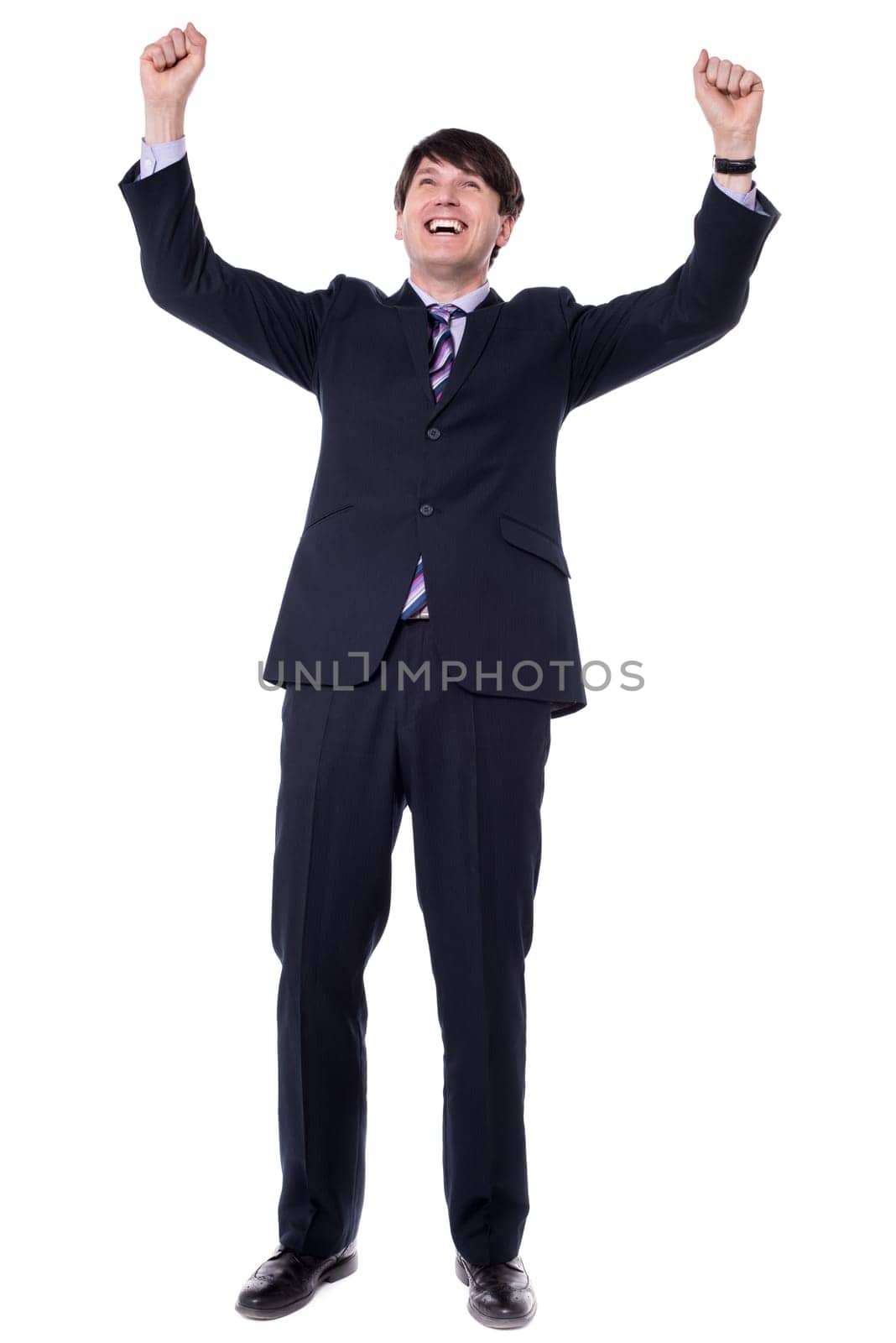 Successful businessman celebrating - isolated over a white background