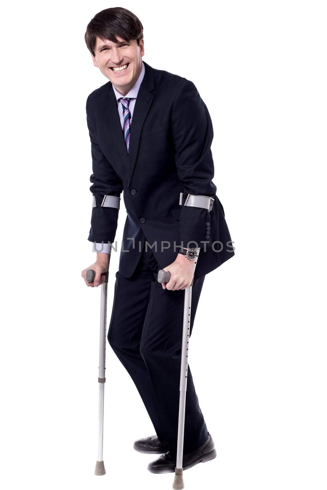 Businessman with crutch isolated on white background.