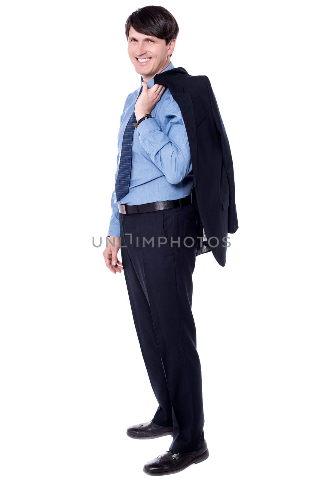 Businessman holding his coat over his shoulder in full length pose.