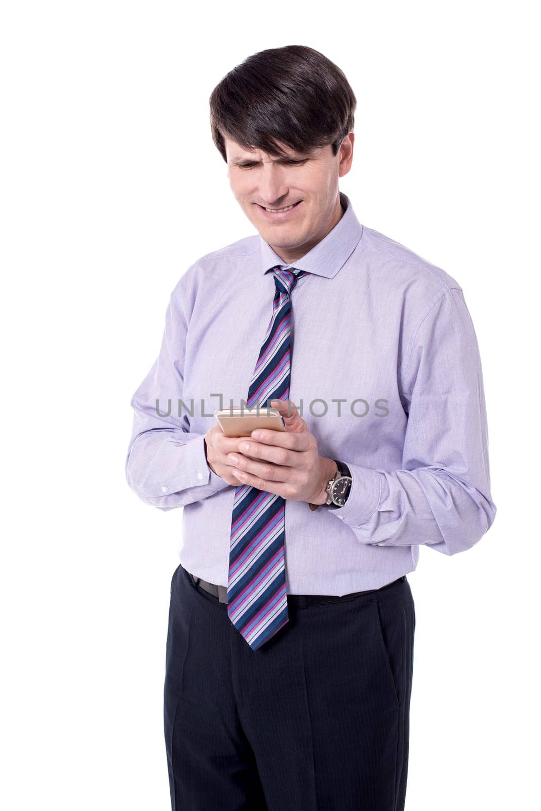 Professional man typing text message in smart phone.
