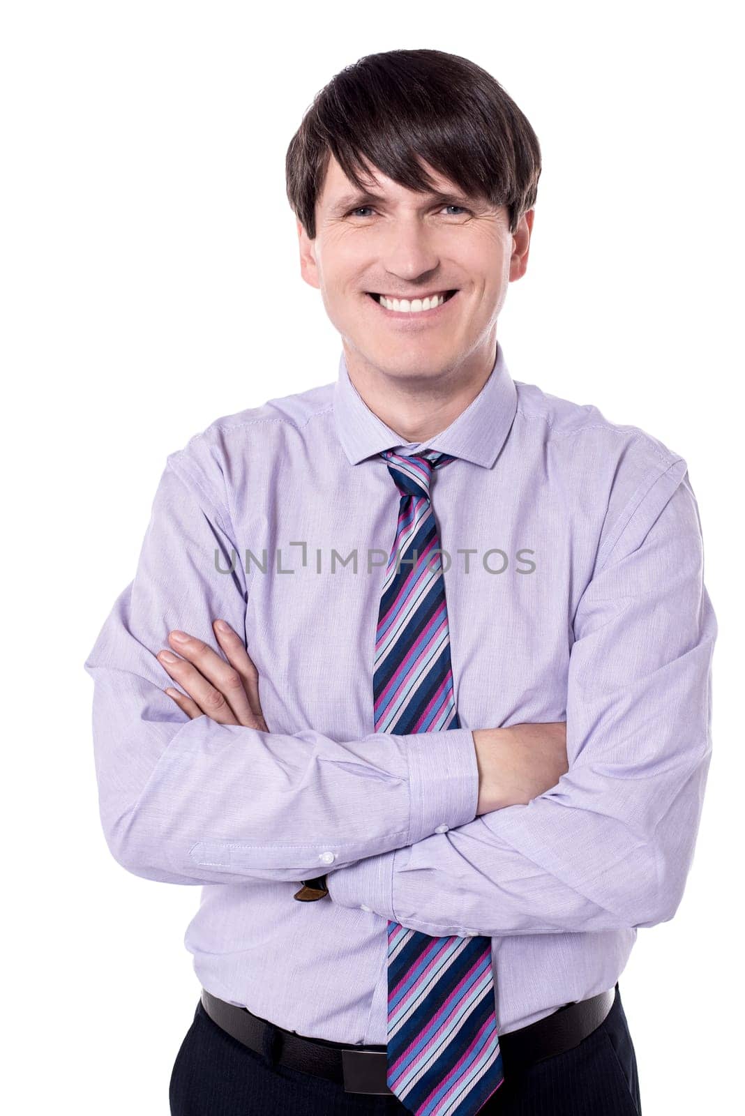 Elegant middle aged businessman posing with crossed arms.