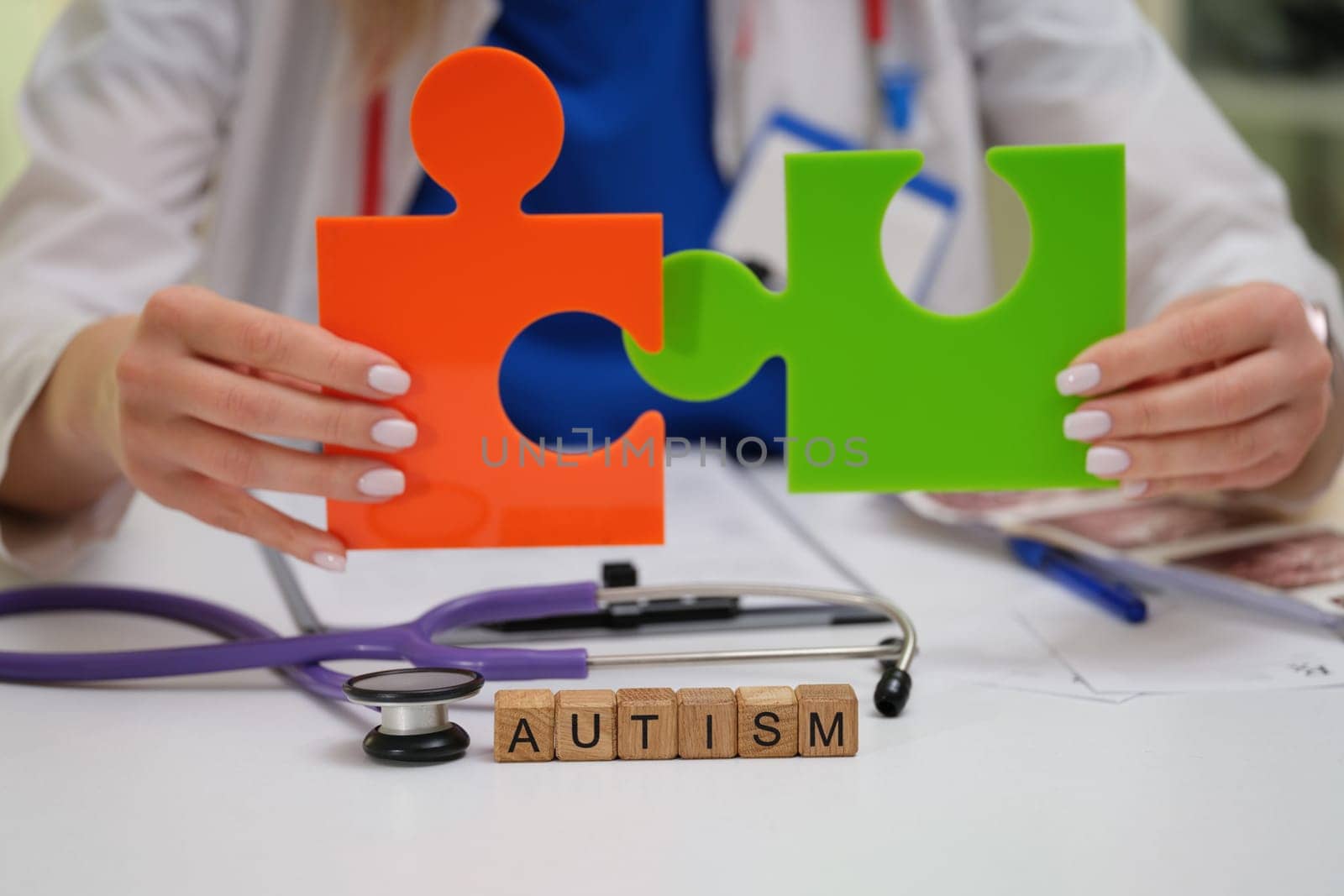 A dedicated healthcare professional shines a light on autism awareness through the use of colorful puzzle pieces