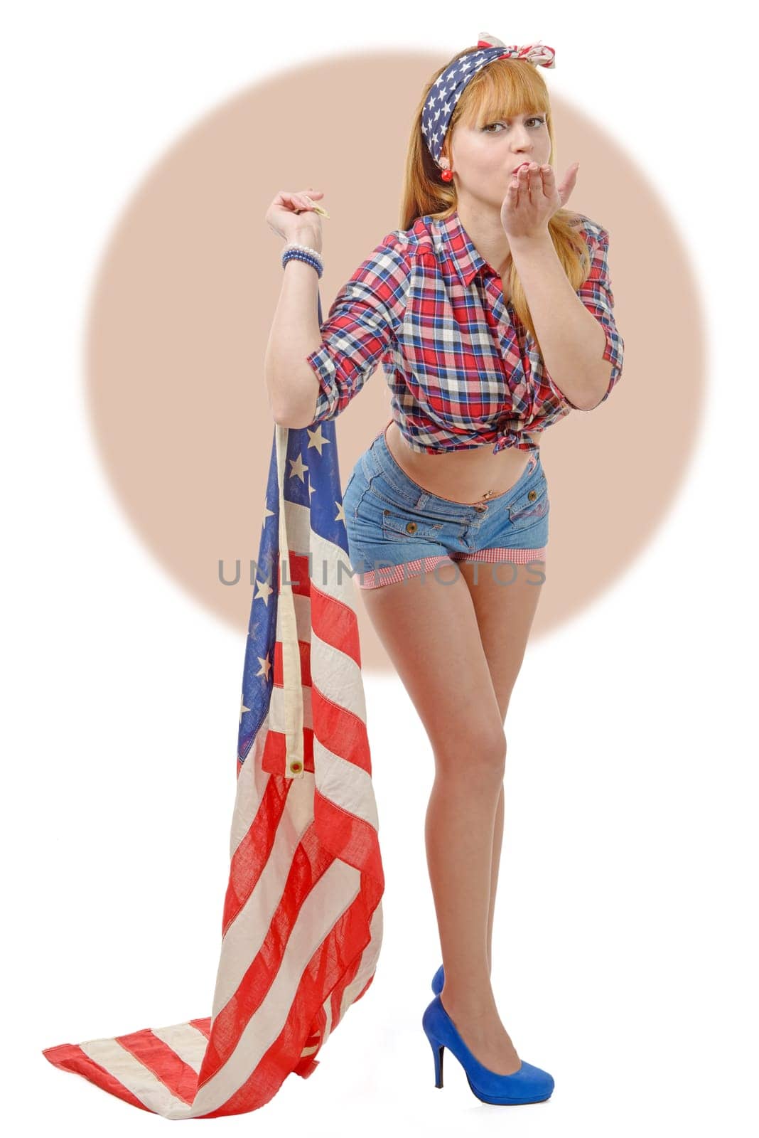 a sexy pin up girl  holding an American flag.