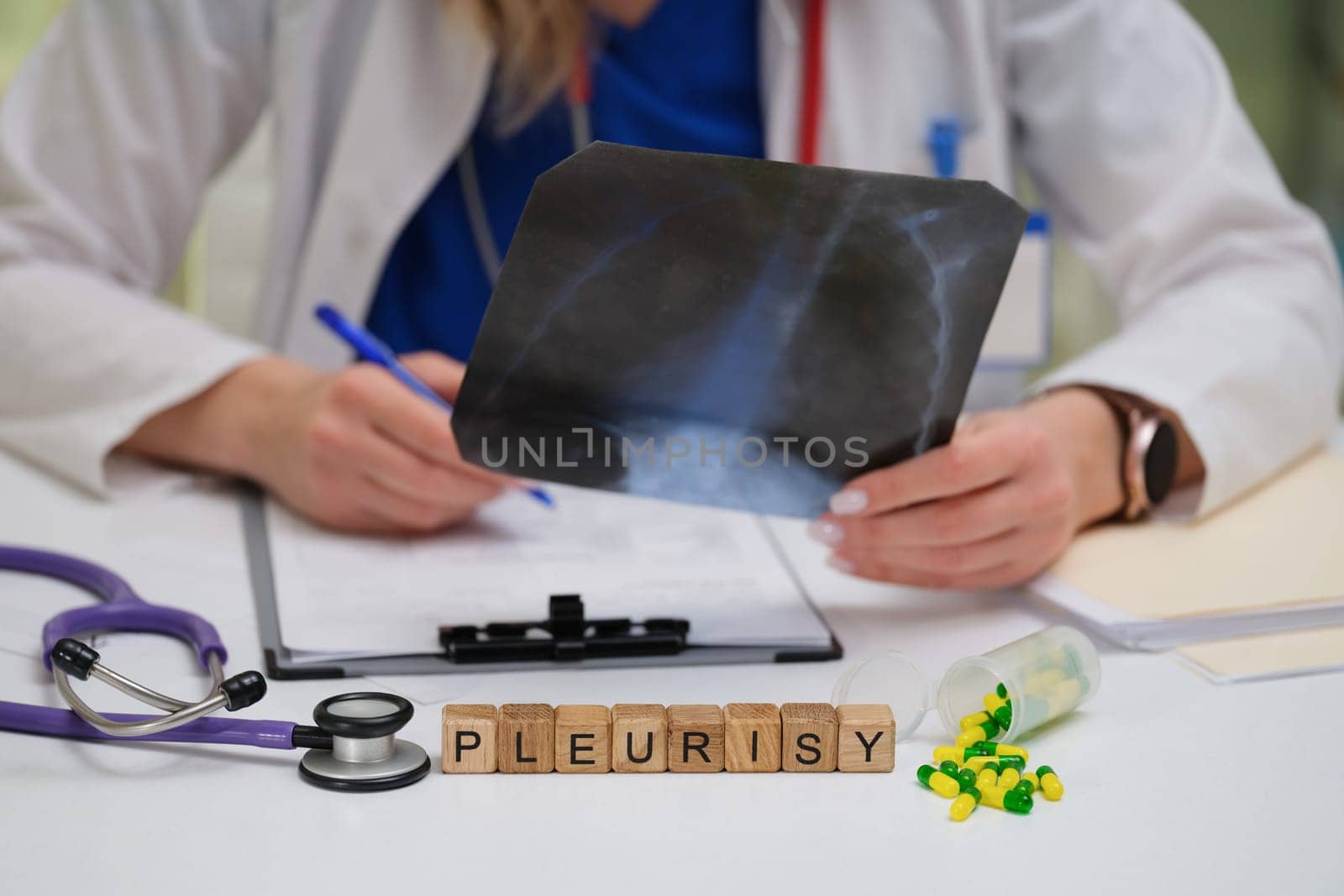 An experienced physician reviews Xray images to assess pleurisy and explore effective treatment options