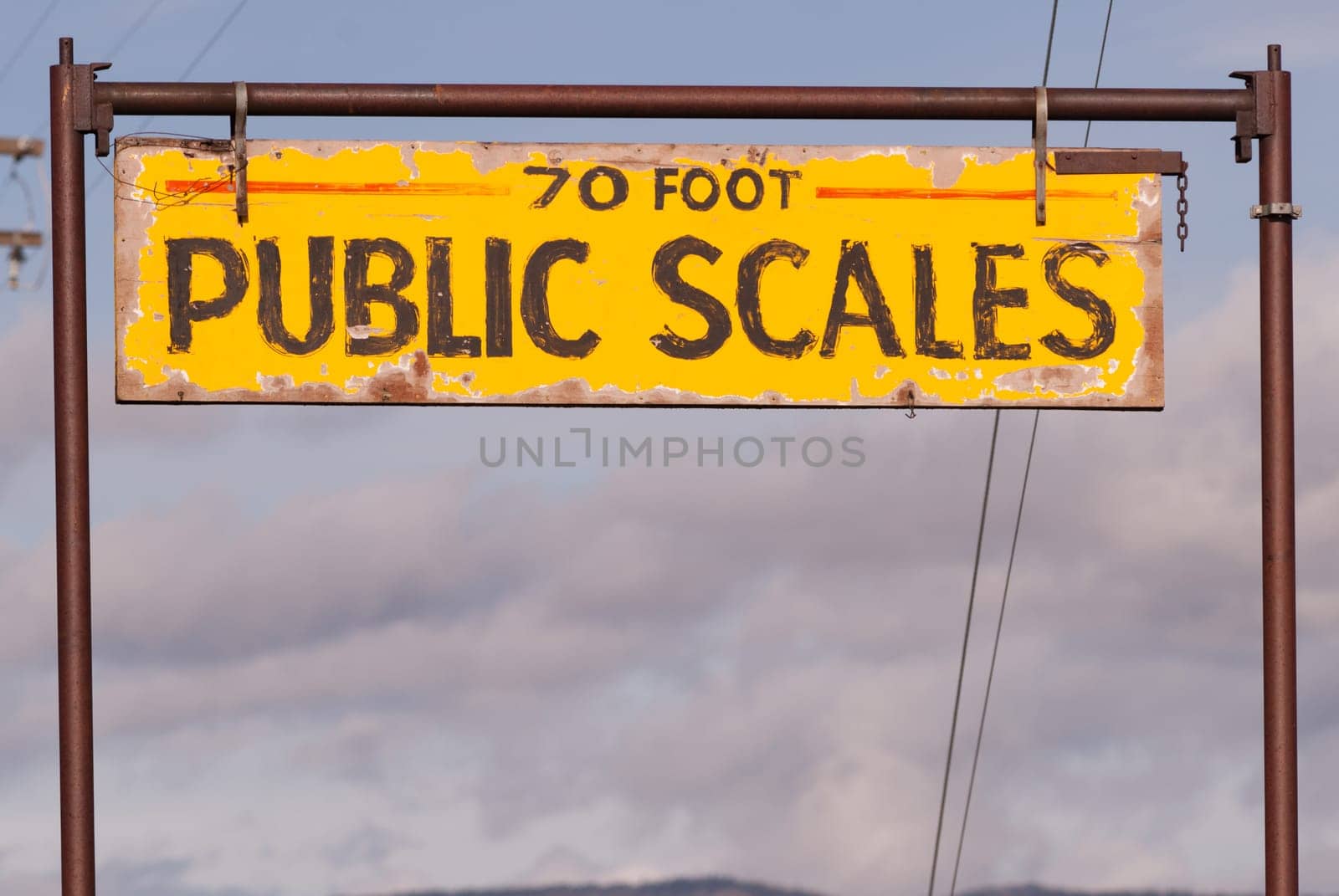 An old sign says "70 Foot Public Scales"""