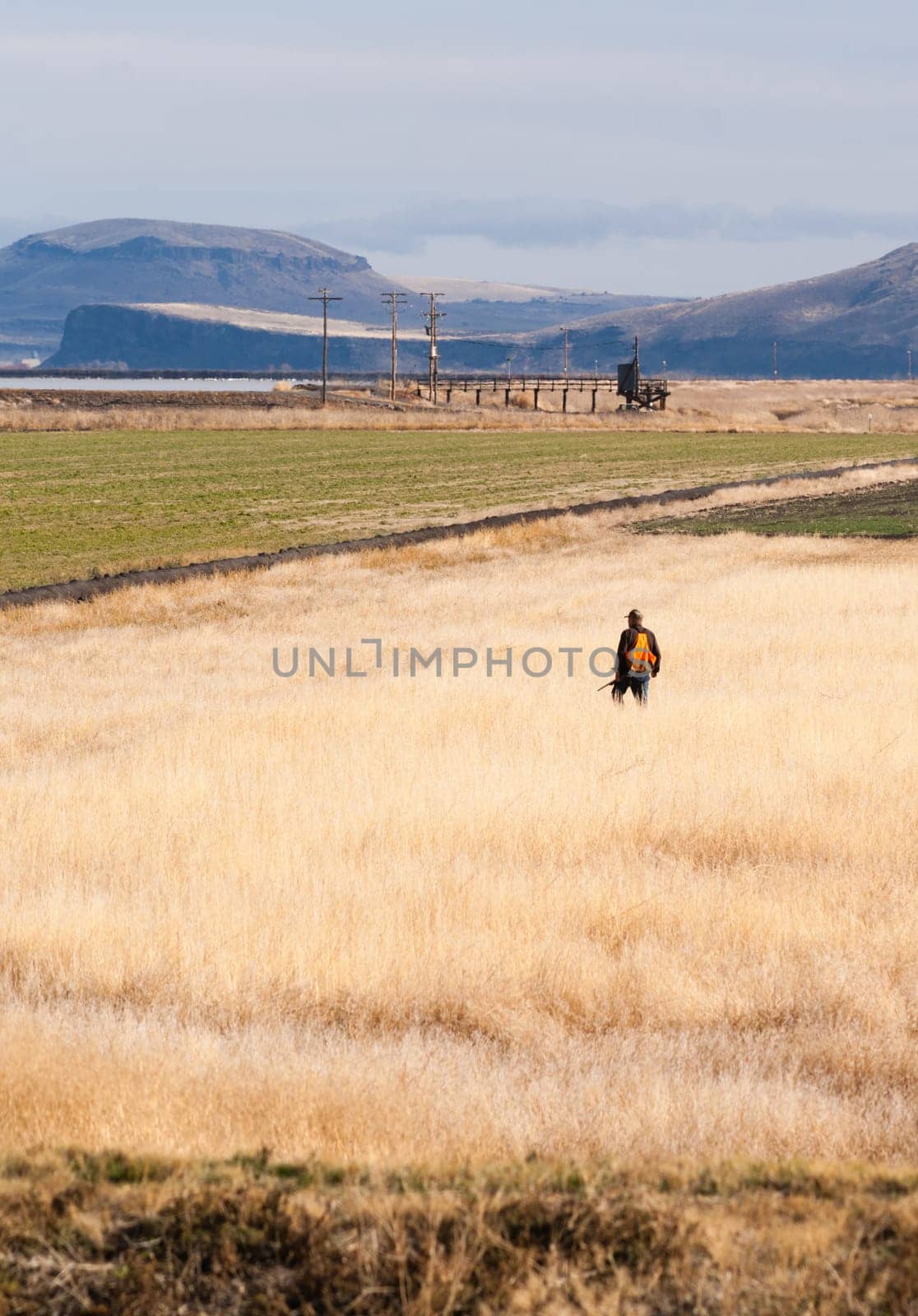 A man wears orange to keep safe during hunting season
