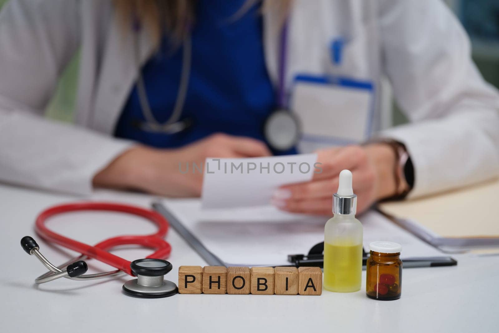 A medical professional reviews clinical notes on phobias, highlighting the importance of mental health awareness