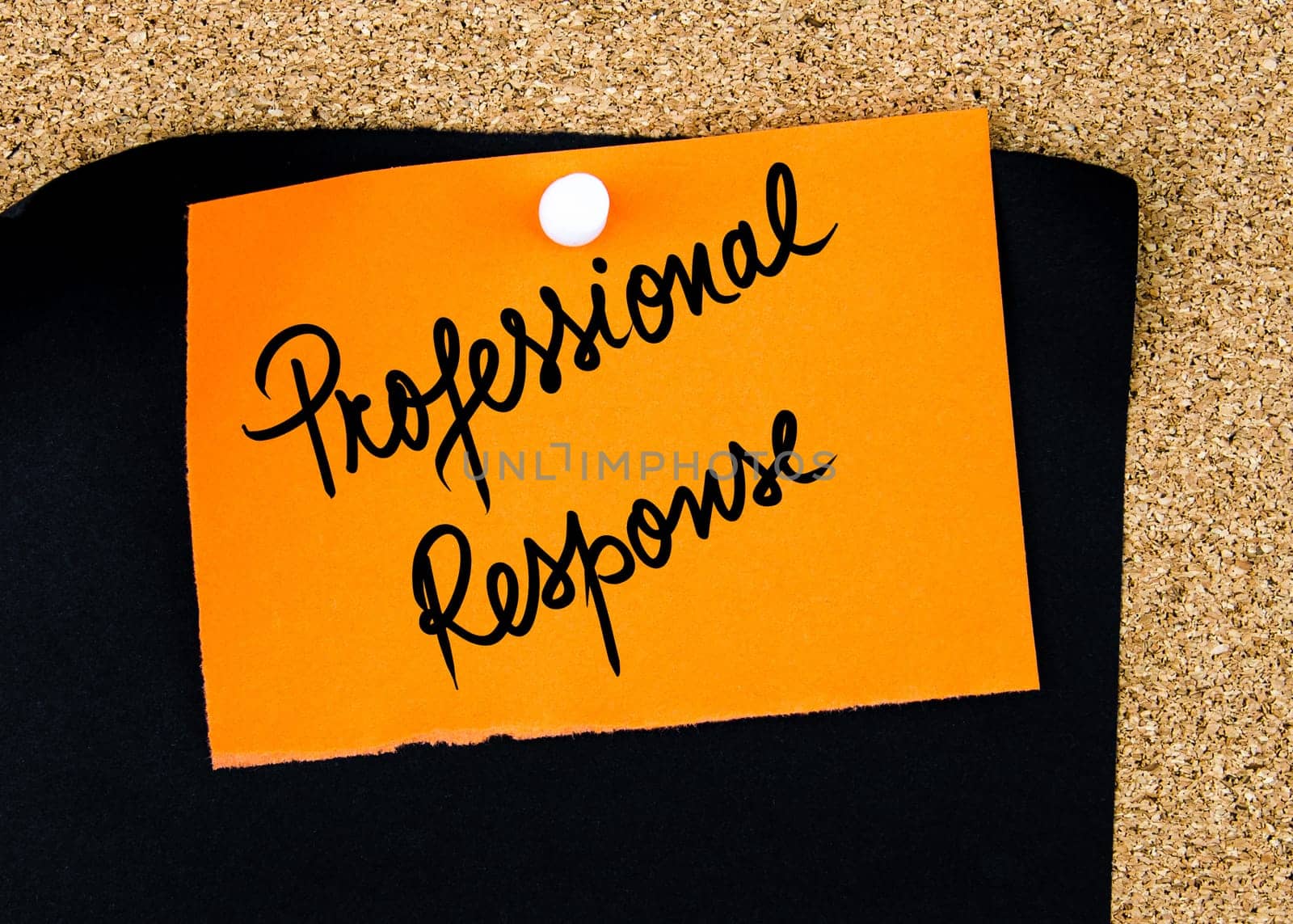 Professional Response written on orange paper note pinned on cork board with white thumbtacks, copy space available