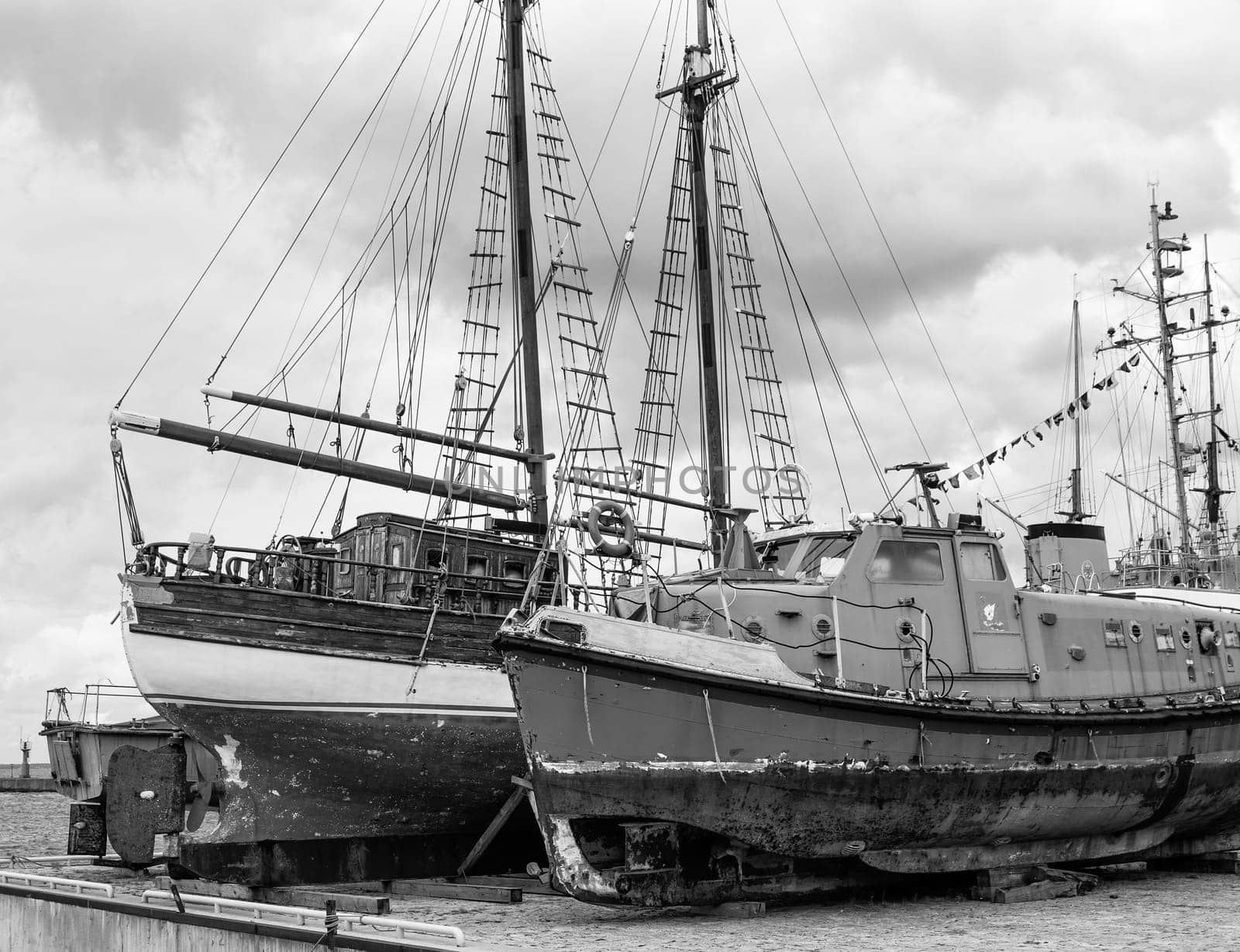 Old collapsing sailboats at the dock, close-up