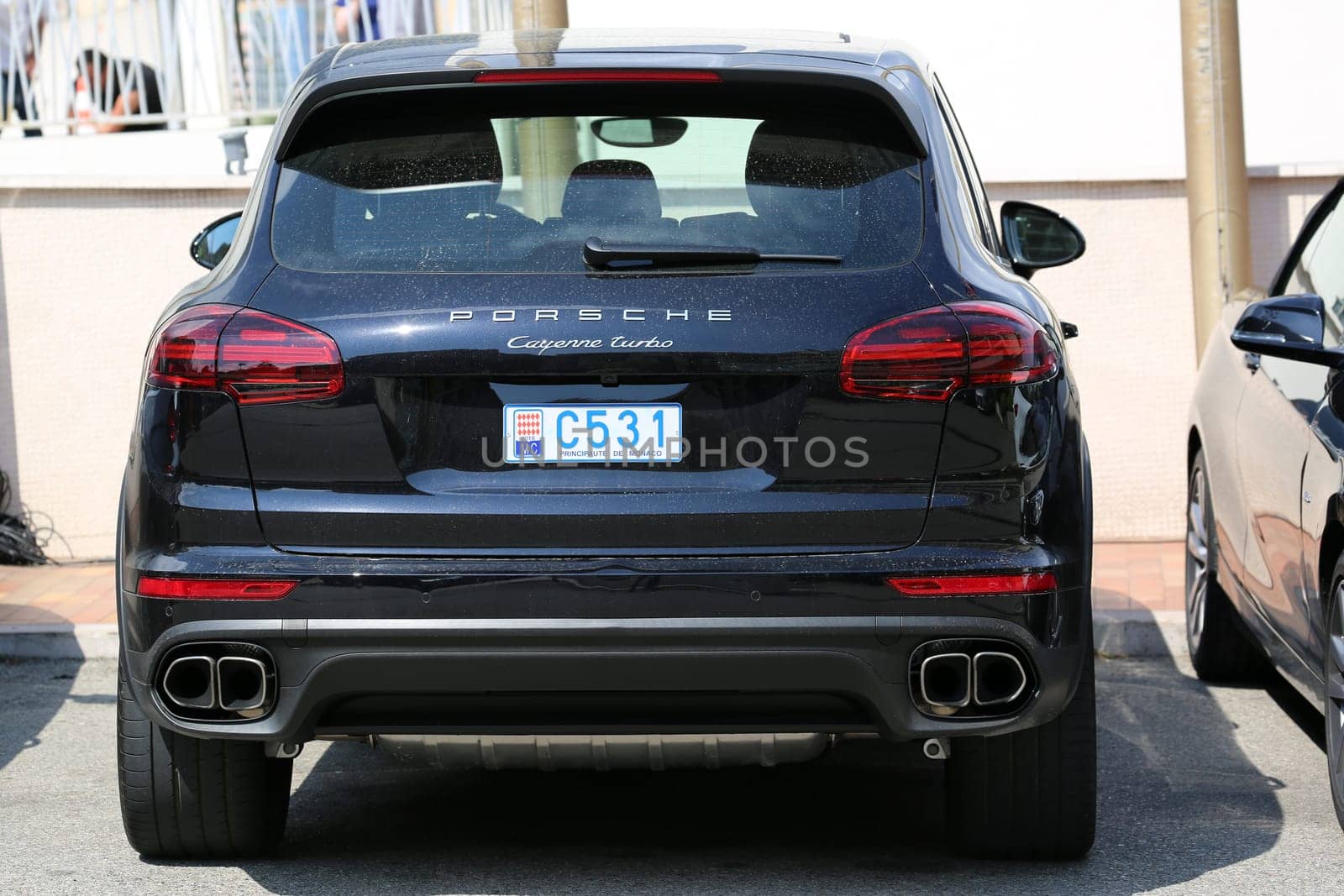 Monte-Carlo, Monaco - May 18, 2016: Luxury Black SUV Porsche Cayenne Turbo Parked in Front of the Fairmont Monte Carlo Hotel