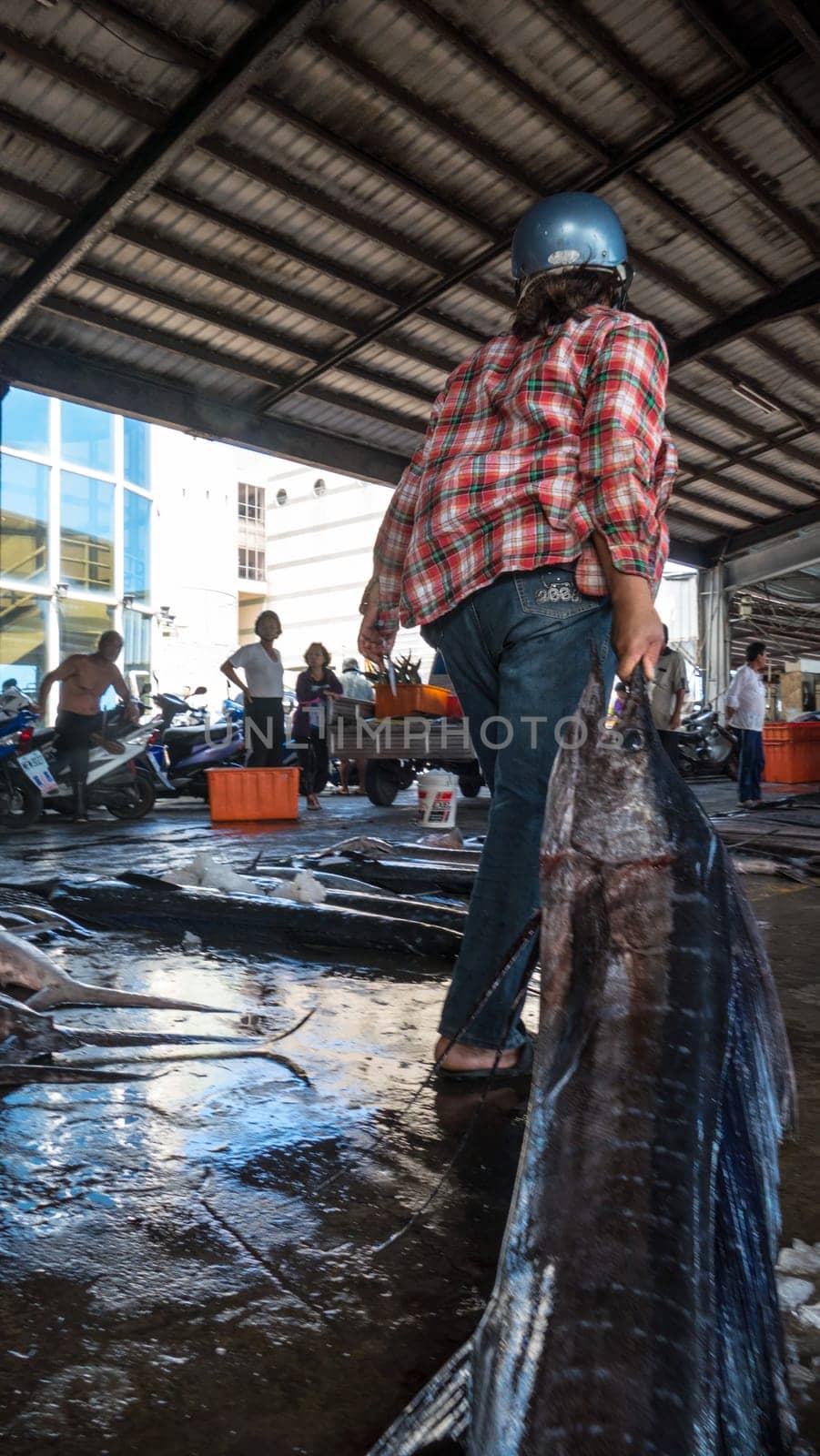 Taitung, Taiwan - May 28, 2016 : Fishing boats docked Chenggong Fishing Harbor remove fishing goods