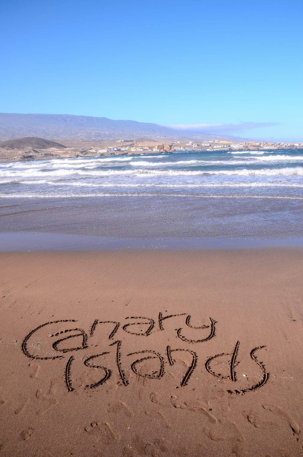 Word Written on the Sand of a Tropical beach