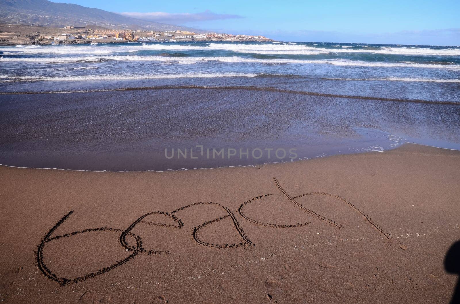 Word Written on the Sand of a Tropical beach