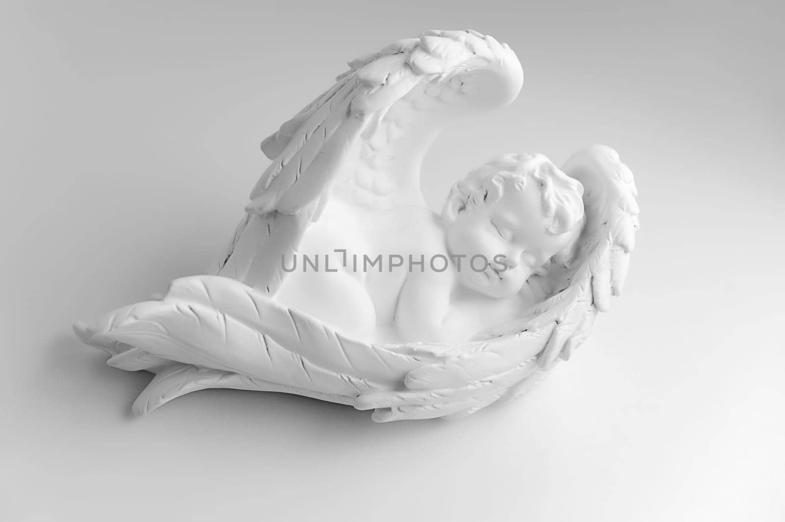 Little Sleeping Angel on white background, black and w