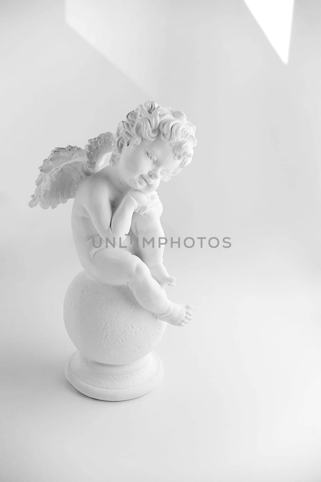 Little Sleeping Angel on white background, black and w