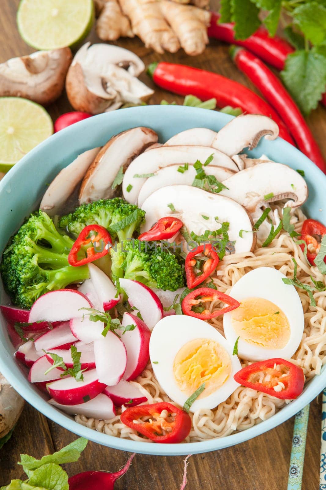 Asian noodle soup with fresh vegetables and boiled egg