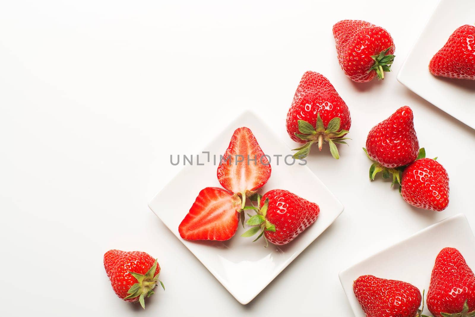 Fresh red strawberry on a white background close up.
