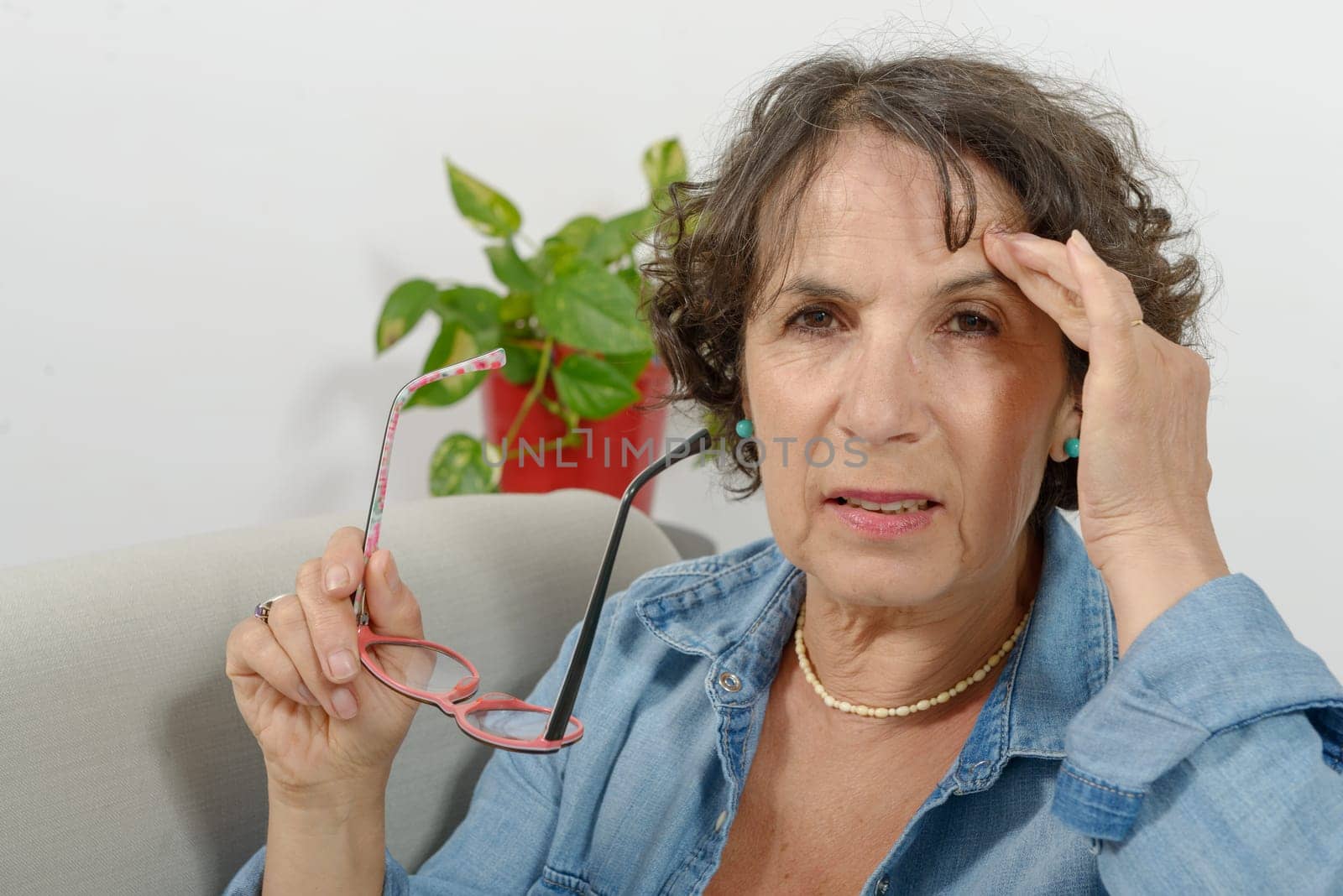 a middle-aged woman has headache