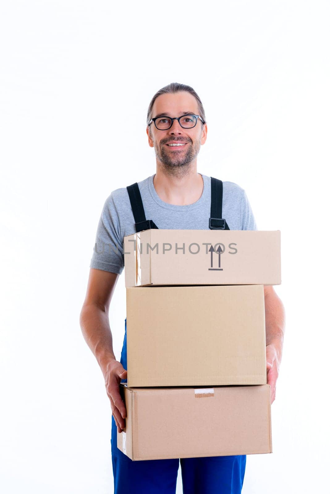 friendly postman with parcels in front of white background