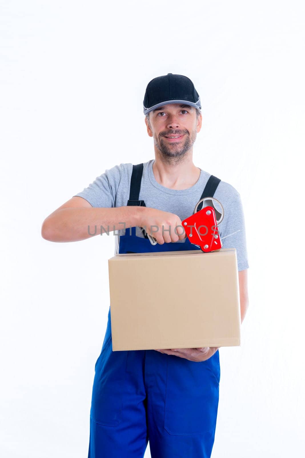 friendly postman with parcels in front of white background