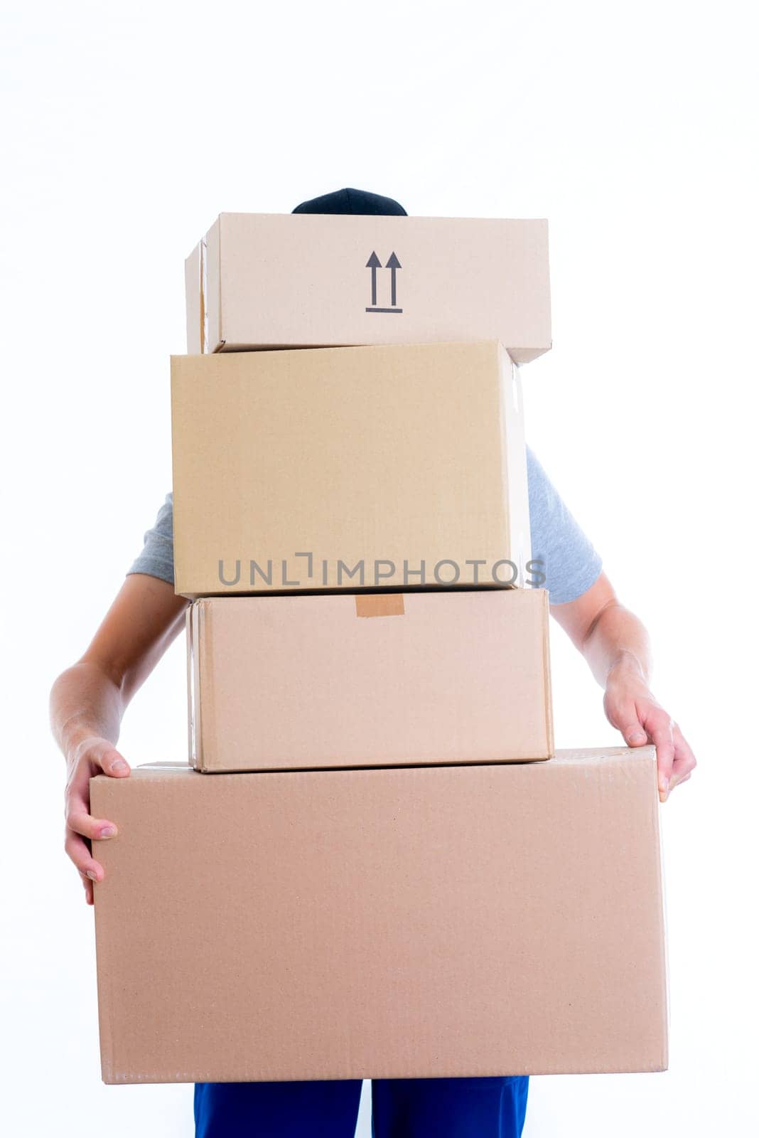 overstrained postman with parcels in front of white background