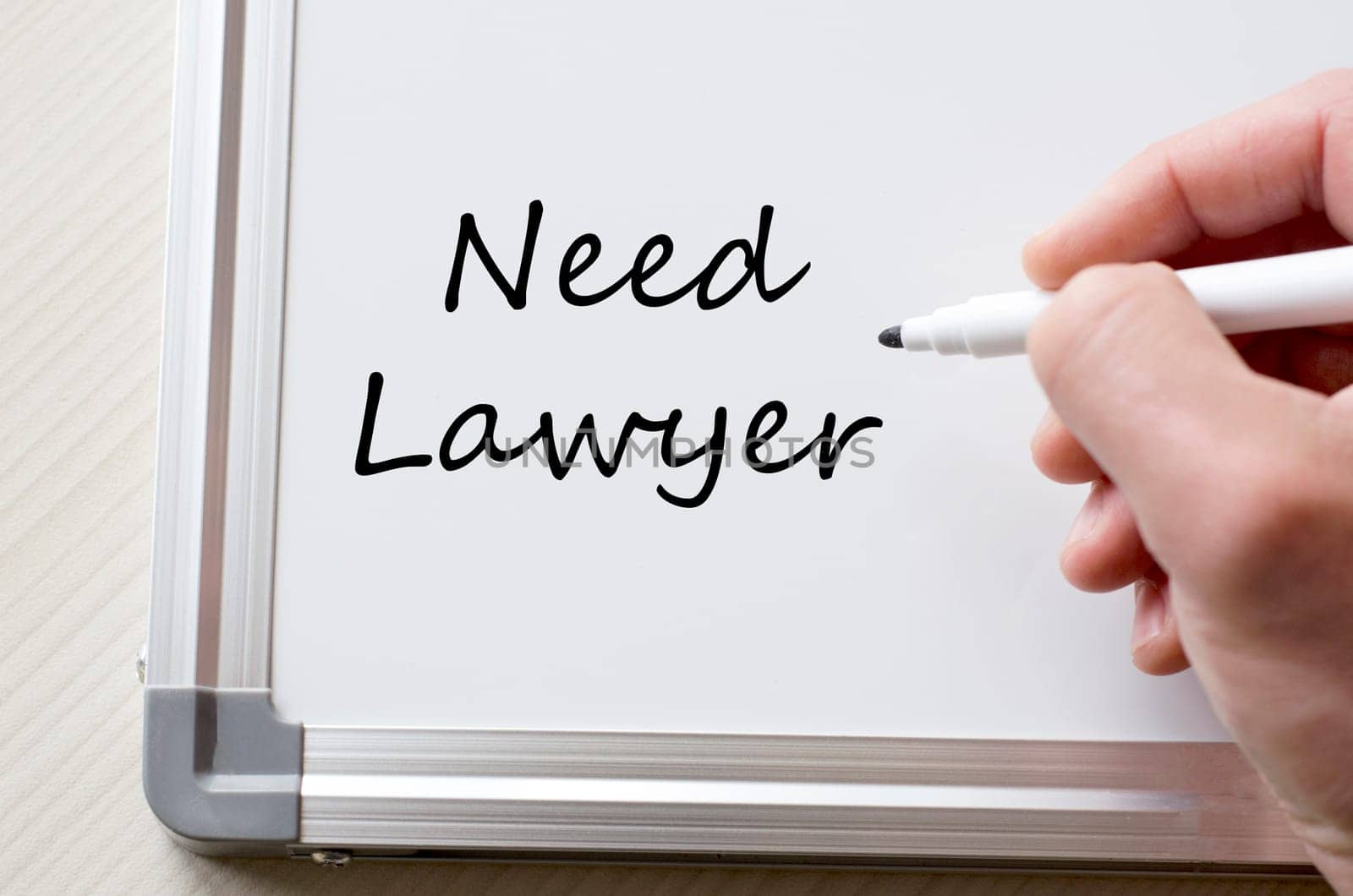 Human hand writing need lawyer on whiteboard