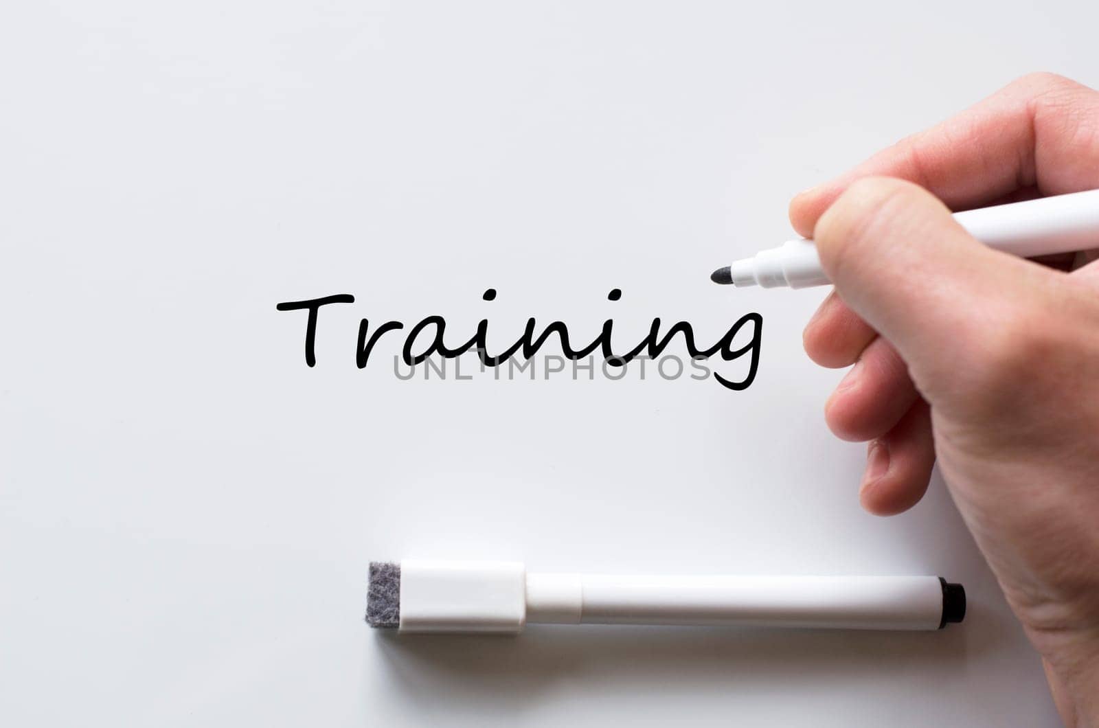 Human hand writing training on whiteboard